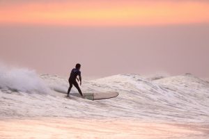 Surfer on longboard