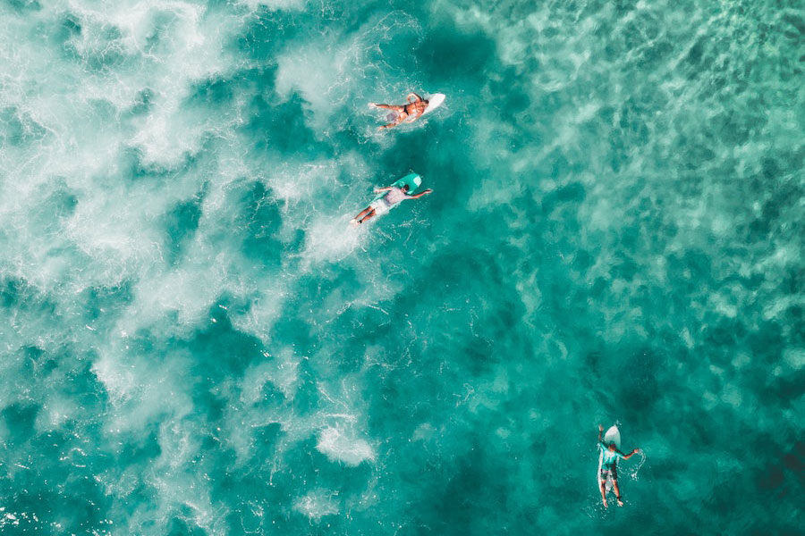 Surfers in a group putting the blue mind theory into practice