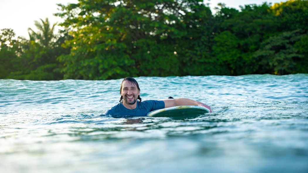 A surfer showing positive energy