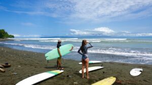 Surfers checking the waves surrounded by a mix of pu boards and epoxy boards